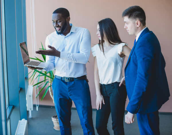 three-business-people-with-laptop