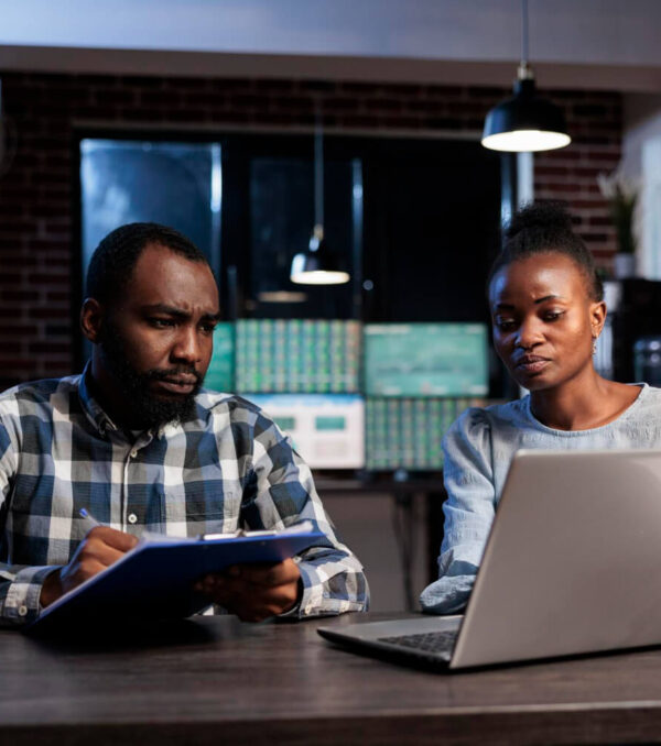 trading-company-professional-agents-sitting-desk-while-reviewing-investment-documentation-reports-hedge-fund-agency-employees-sitting-desk-office-workspace-while-analyzing-financial-data